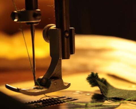 bernina - Detailed view of a sewing machine needle stitching fabric, highlighting craftsmanship.