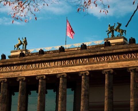 ddr museum berlin - Elegant facade of Altes Museum in Berlin with sunlight illuminating classical ar