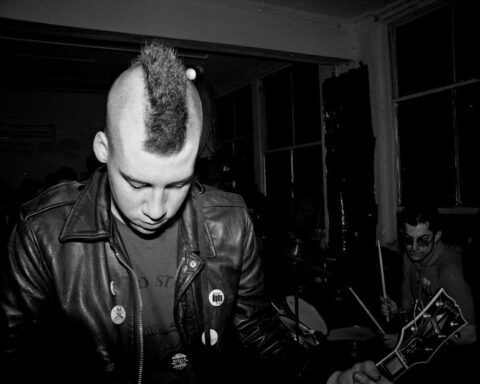 sid vicious - Moody monochrome image of a punk band capturing the energy of live music.