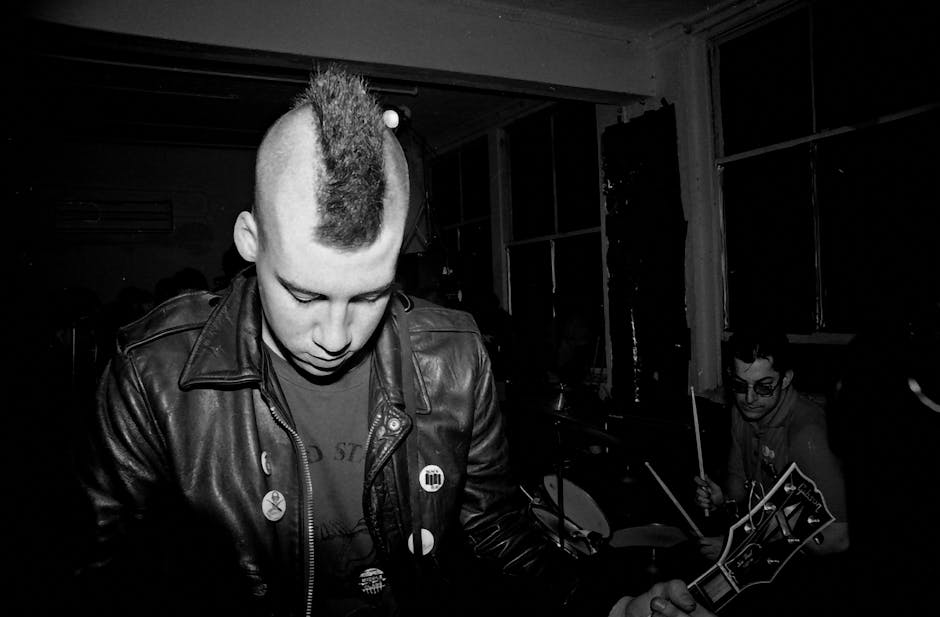 sid vicious - Moody monochrome image of a punk band capturing the energy of live music.